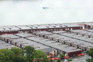 韩国球员住名古屋集装箱床伸不开腿 史上最差住宿条件引发争议
