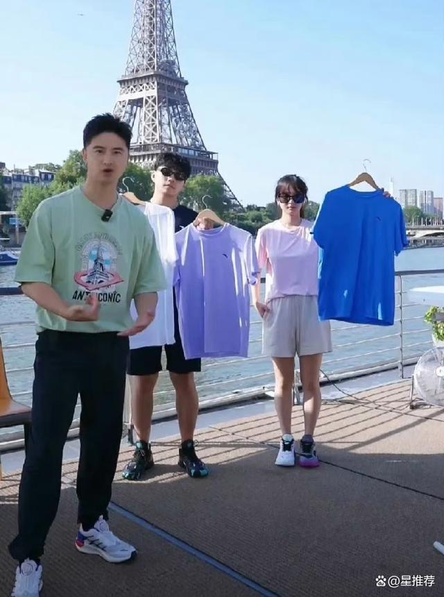 田亮带着儿子女儿在巴黎铁塔下卖货 网友吐槽引争议