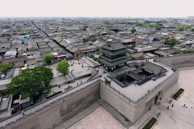 Pingyao Ancient City: A Beacon of War on the Gate Tower, a City's Glory on Screen