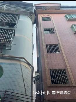 廣州震后兩棟樓貼在一起 安全隱患引關(guān)注
