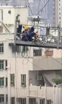 台风天2名工人被困高空 官方调查 冒险作业引发关注